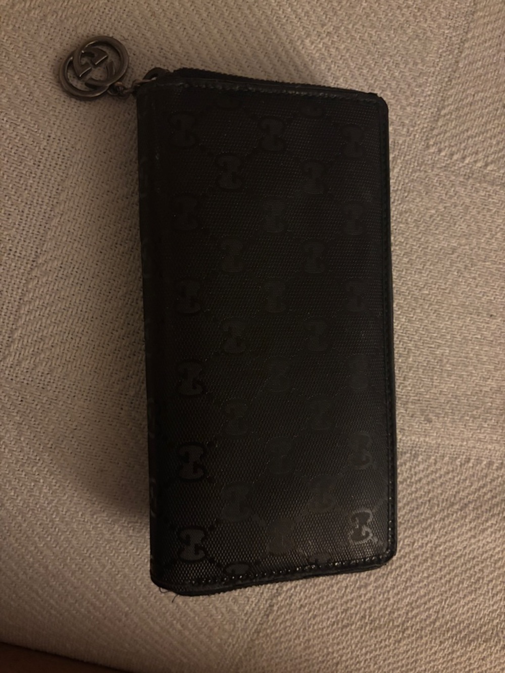 Gucci Black Embossed GG Zip Wallet with Logo Charm